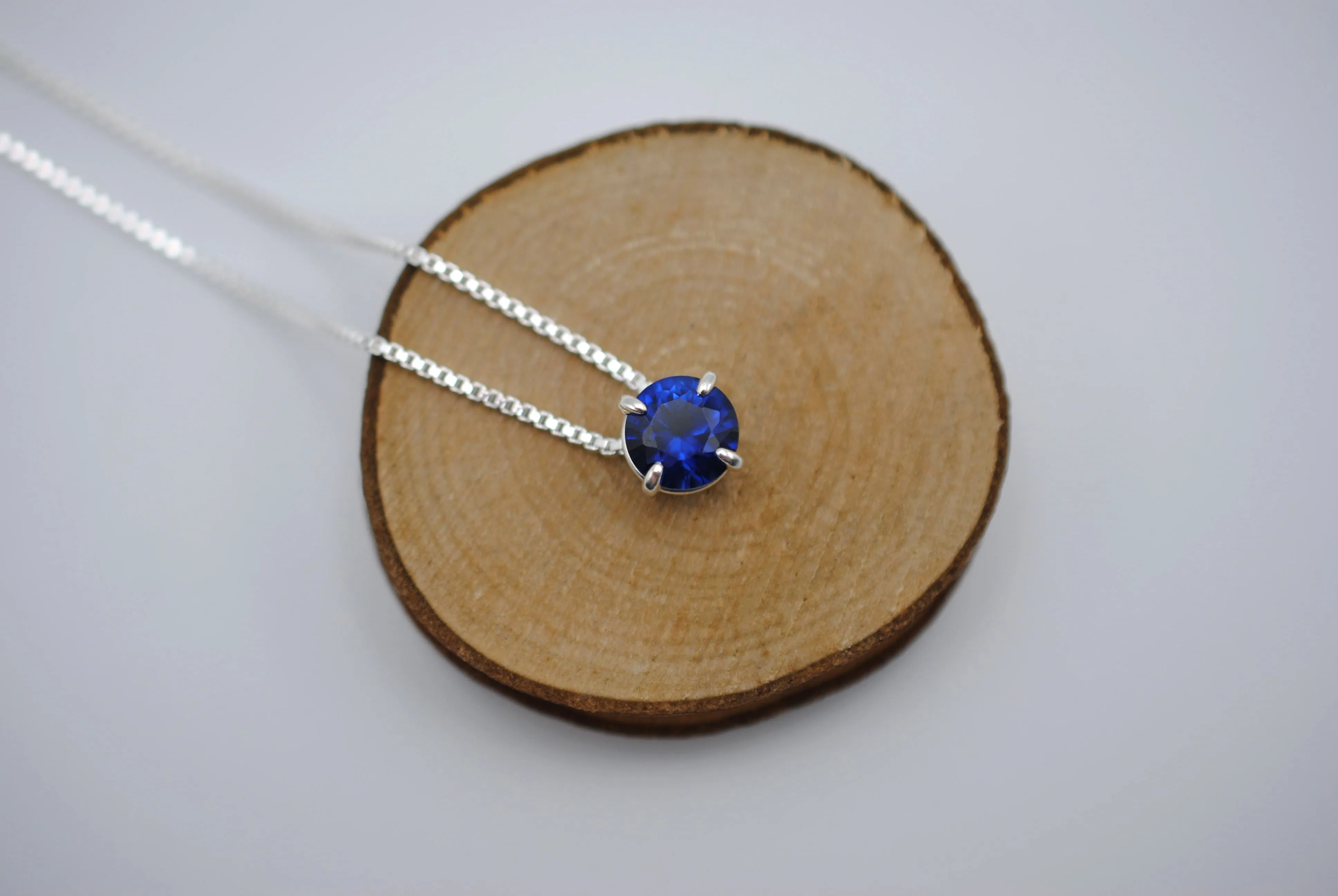 Birthstone Necklace: Round Sapphire, Silver Prong Setting, Adjustable Box Chain
