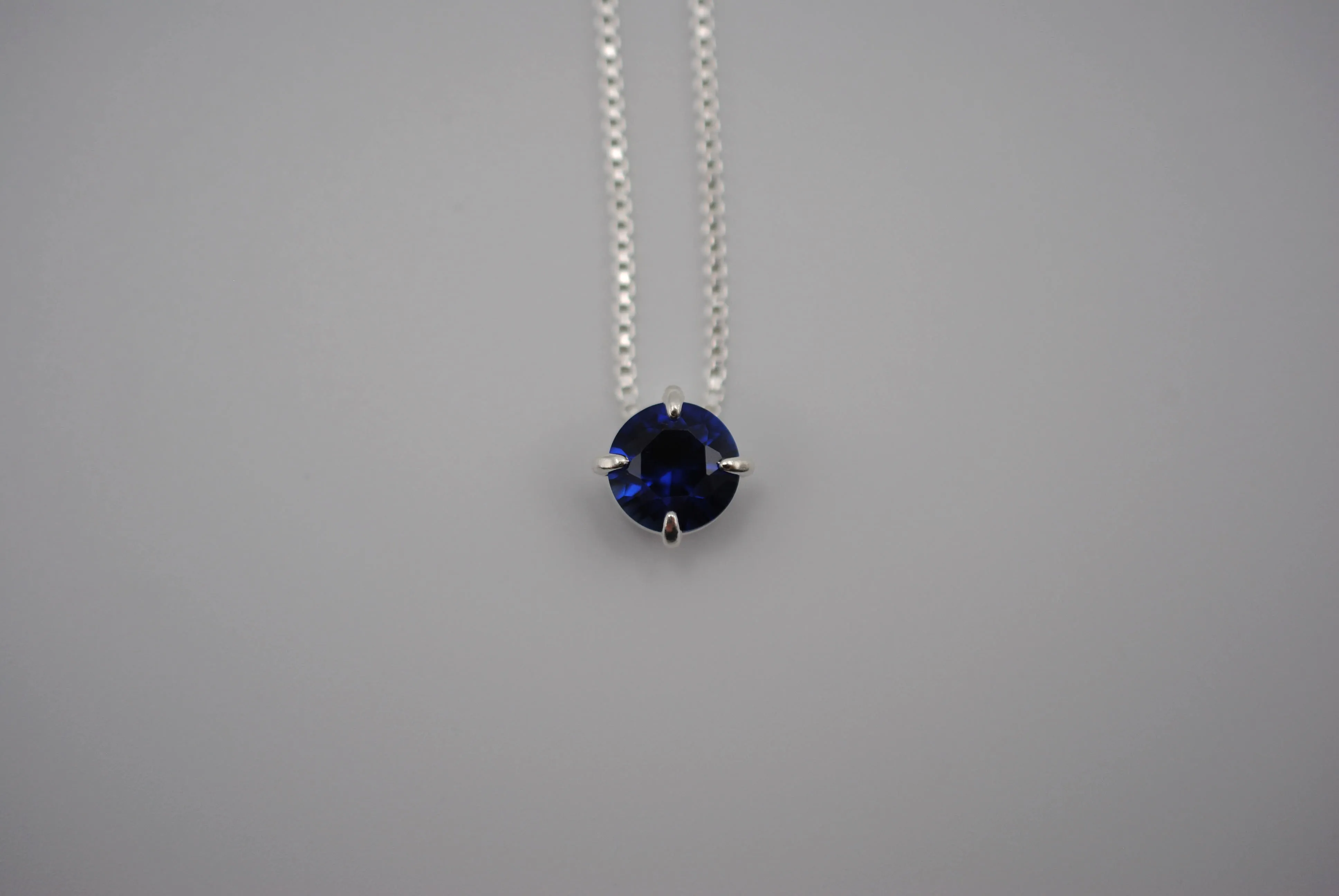 Birthstone Necklace: Round Sapphire, Silver Prong Setting, Adjustable Box Chain