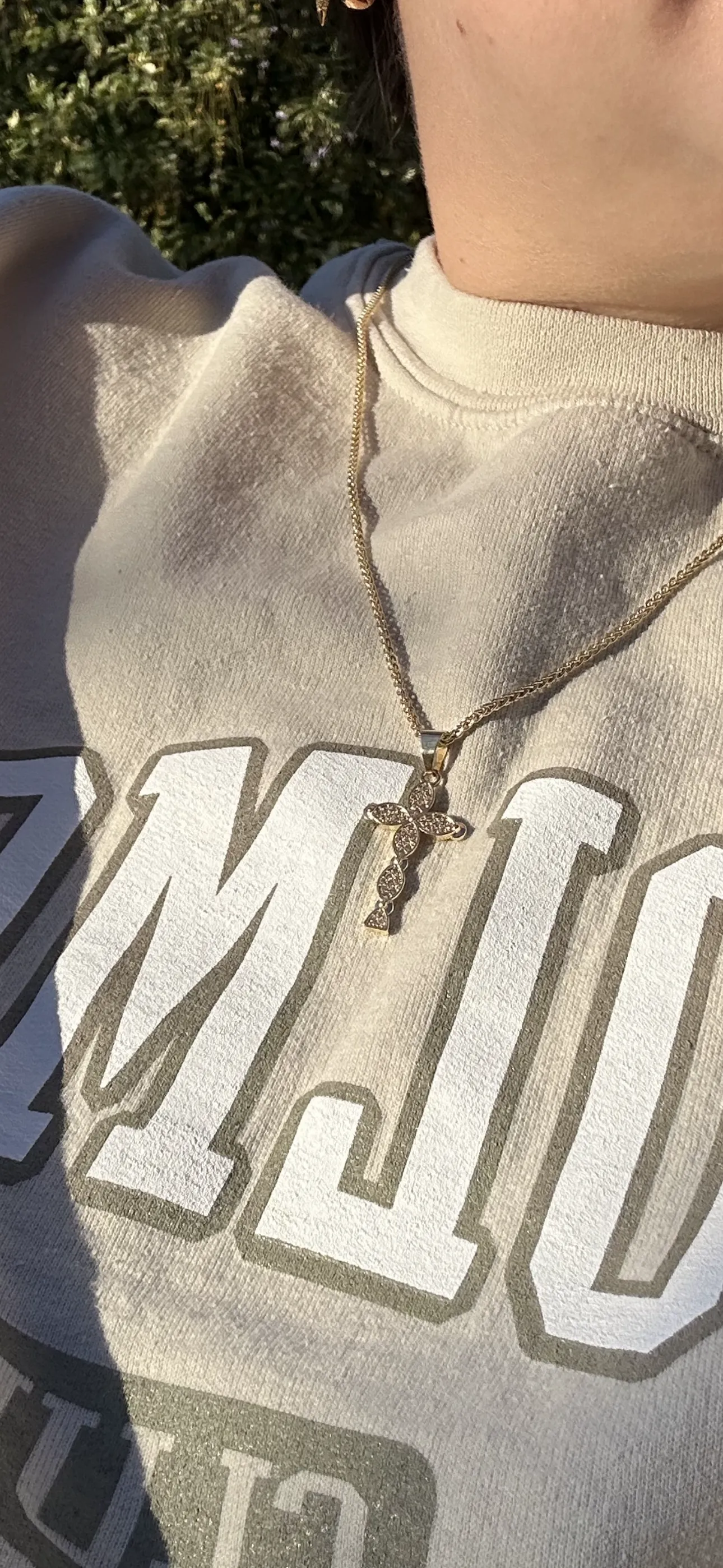 cher cross necklace
