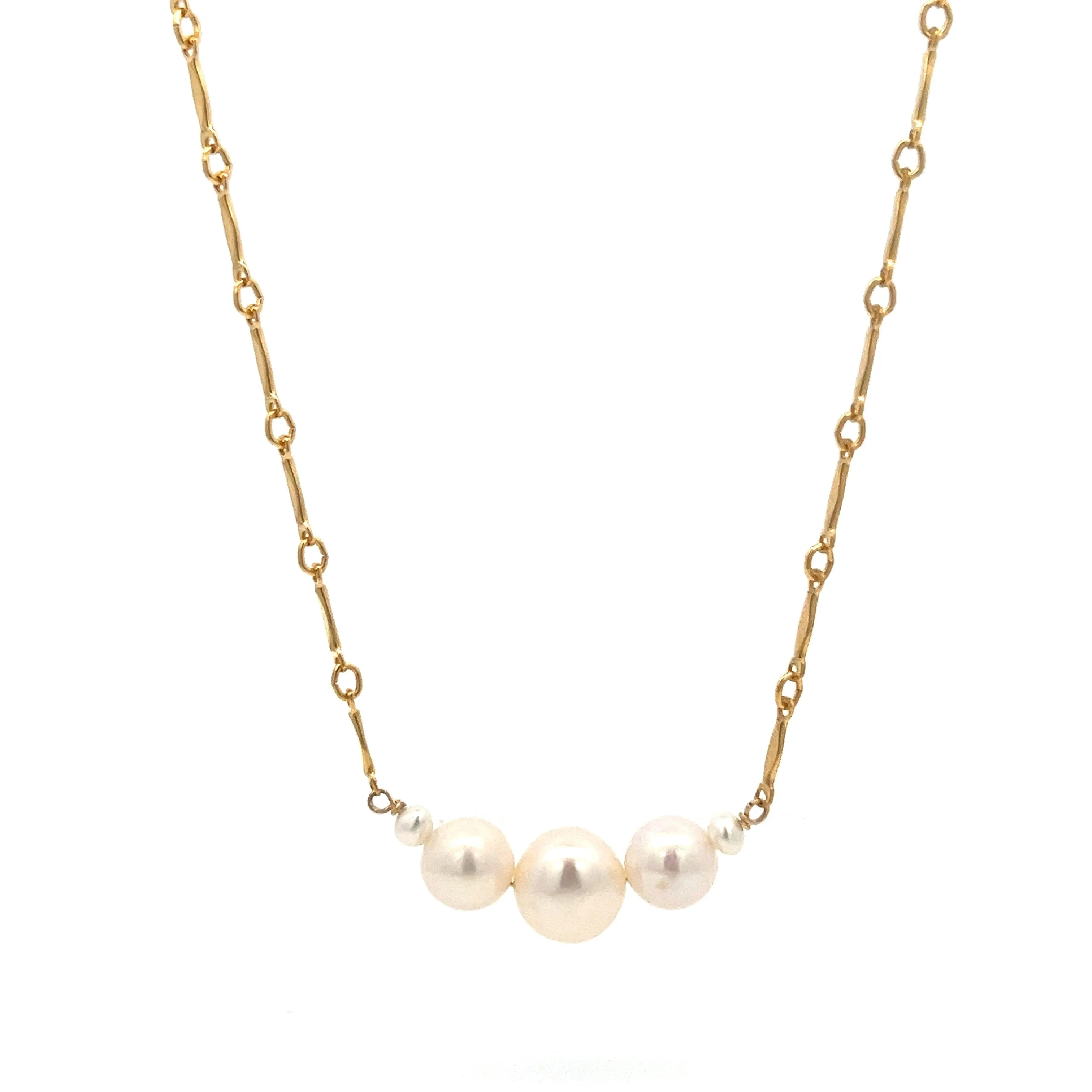 graduated five-pearl and gold bar necklace